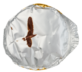 Round aluminum thin lid for plastic yogurt jars, sour cream on a white background, top view