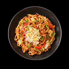 Delicious stir-fried noodles with vegetables and meat served in a black bowl against a dark background