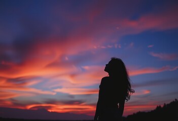 silhouette of a person at sunset