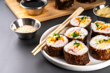 Traditional Korean food kimbap, with ham, vegetables and lettuce