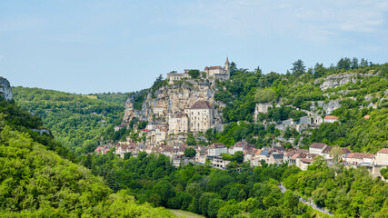 Fototapeta premium View of the city of Rocamadour Lot Occitanie in Southern France in summer. The city was built on a rock above the river Alzou and founded in the early middle ages by the hermit Amadour.