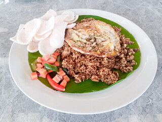 a plate of special fried rice made by a skilled chef, served on an aesthetic wooden table