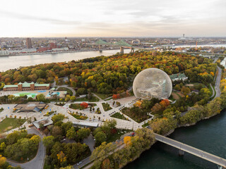 Aerial view of Montreal Biosphere in autumn sunset time. St. Lawrence River, Jacques Cartier Bridge...