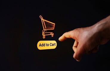 A finger points towards a floating shopping cart with the “Add to Cart” button. Online shopping and the digital purchasing process concept.