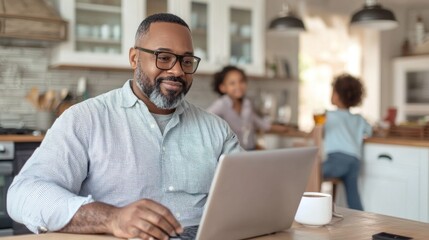 Fototapeta premium Smiling plus-size black man working on laptop at home with family in the background