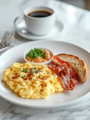 Naklejka premium A delicious breakfast plate with scrambled eggs, bacon, toast, and a side of fruit.