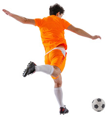 Back view image of young man, soccer player wearing orange uniform, in motion with ball, training isolated on white transparent background. Concept of sport, competition, active lifestyle, game