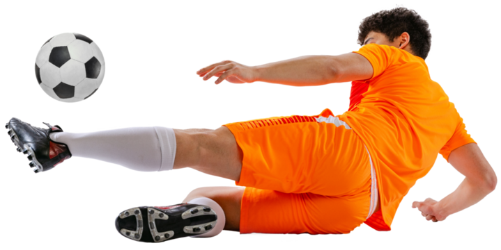 Dynamic image of determined athlete, soccer player in orange football kit training falling down while kicking ball isolated on white transparent background. Concept of sport, competition, game - Powered by Adobe