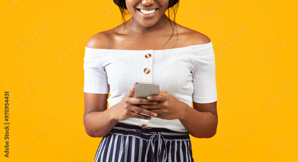 Poster mobile app. unrecognizable afro woman using cellphone browsing internet or texting standing over ora