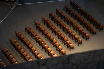 Top view of row of chairs in Duomo di Siena, a medieval church dedicated to the Assumption of Mary.