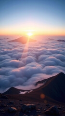 雲海の上に浮かぶ山々と、日の出がピンクとオレンジの光で輝く壮大な風景。柔らかな青い空と雲が広がり、日の光が雲を照らし、幻想的な雰囲気を醸し出している。
