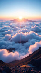 雲海の上に浮かぶ山頂に昇る太陽、澄んだ青空と柔らかいピンク色の雲が幻想的な風景を作り出し、日の出の光が空と雲を美しく染め上げている壮大なシーン。