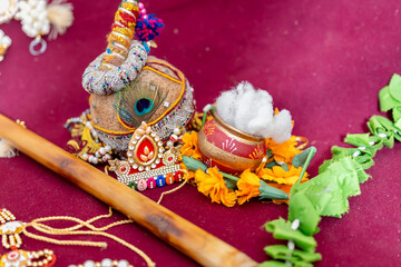 hindu god krishna holy peacock feather and flute indoor shot from different angle