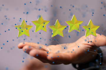 Hand Holding 3D Stars Representing Ratings