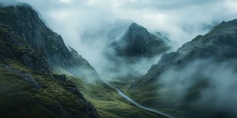 Fototapeta premium Mysterious mountain landscape enveloped in mist, creating an ethereal atmosphere in nature's untouched beauty.