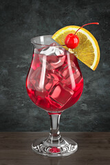 Glass with cocktail on the wooden table against the wall in the grunge style. Bar theme. Drink with orange and cherry. Dark environment. 3d rendering.