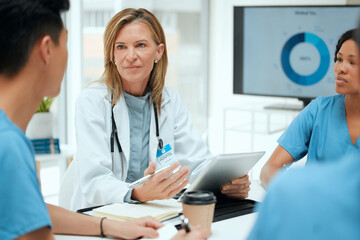 Doctor, teamwork and medical students on technology with group for healthcare, review or feedback. People, communication and staff in discussion for meeting, ideas or internship in clinic or hospital