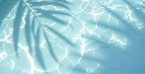 Top view of tropical leaf shadow on water surface. Shadow of palm leaves on white sand beach. Beautiful abstract background concept banner for summer vacation at the beach.	