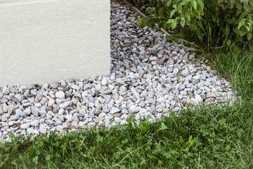 Drainage Stone Floor of French Drain on the Corner of Building Foundation 