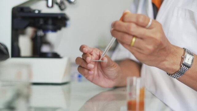 asian microbiologist biotechnology researcher or female medical researchers working in laboratory