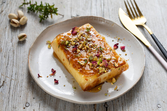 Filo pastry wrapped feta cheese with honey and pistachios