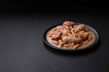 Cassoulet with white beans, meat and sausages, vegetables, salt and spices
