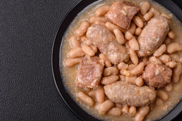Cassoulet with white beans, meat and sausages, vegetables, salt and spices