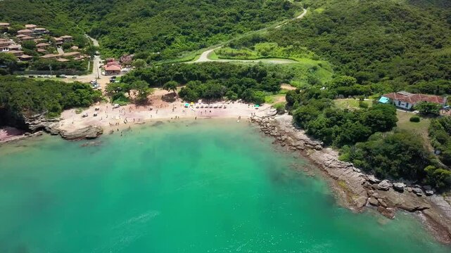 Aerial view of Praia do Forno, Buzios, showing calm waters and green surroundings.
