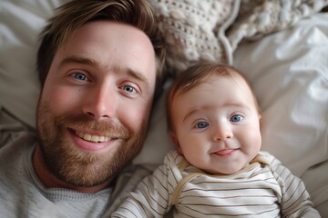 Happy father and smile baby lying in bed, full length top view