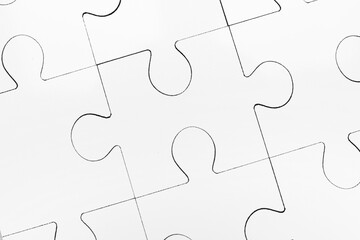 Fototapeta premium White puzzle as background, top view. Intellectual game