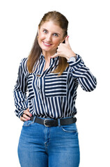 Middle age mature business woman over isolated background smiling doing phone gesture with hand and fingers like talking on the telephone. Communicating concepts.