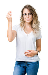 Beautiful young blonde woman wearing glasses over isolated background Doing Italian gesture with hand and fingers confident expression