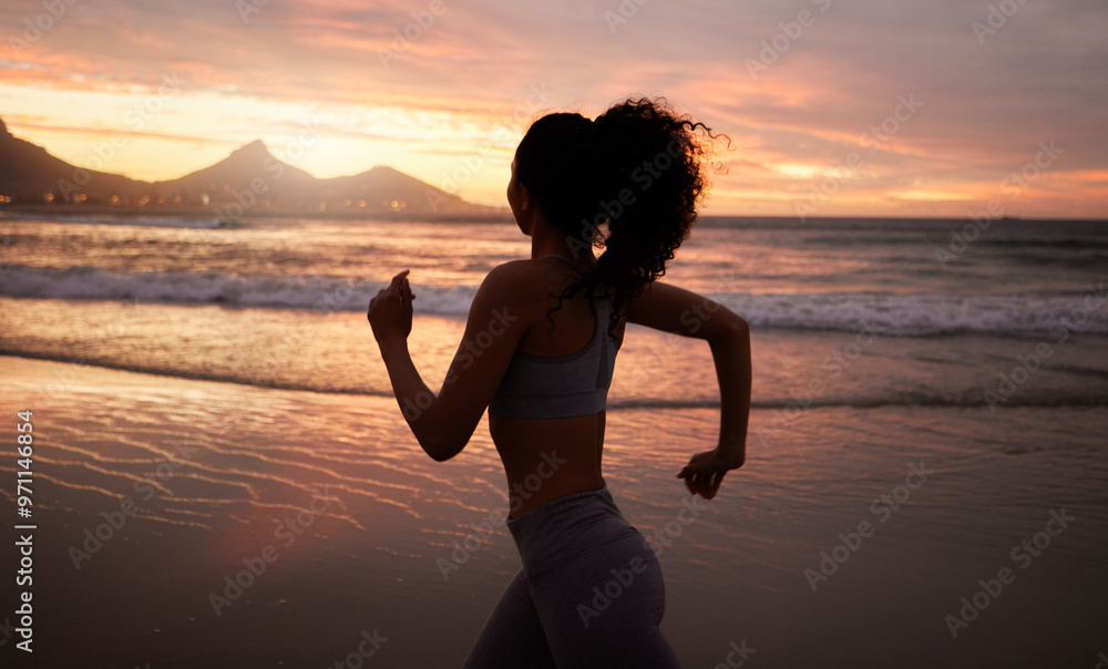 Canvas Prints Woman, running and fitness at beach, sunset and speed for training, wellness and adventure in nature. Person, girl and silhouette at dusk for exercise, fast and workout with health by ocean in Brazil