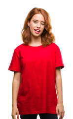 Fototapeta premium Young beautiful woman over isolated background winking looking at the camera with sexy expression, cheerful and happy face.