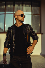 Young beard man posing in the street, fashion beard man portrait, tattoo hand, Handsome, happy face, street photo, hipster style portrait, tattoo, leather jacker, glasses, watch, brutal man,