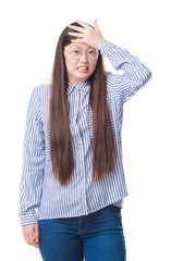 Young Chinese business woman over isolated background wearing glasses stressed with hand on head, shocked with shame and surprise face, angry and frustrated. Fear and upset for mistake.