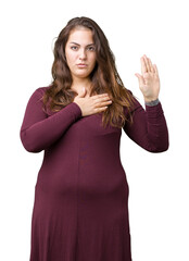 Beautiful and attractive plus size young woman wearing a dress over isolated background Swearing...