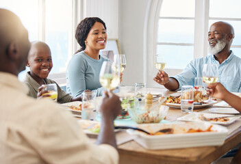 Cheers, smile and food with black family in home for Thanksgiving celebration, festive holiday and brunch. Support, love and party with people and lunch for nutrition, grateful and tradition