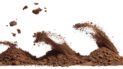 Heaps of soil and soil flying in the wind on a transparent background. PNG