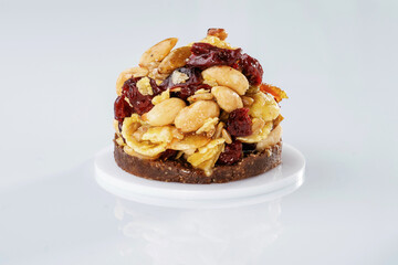 Small sweet dessert with chocolate and almonds isolated against white background