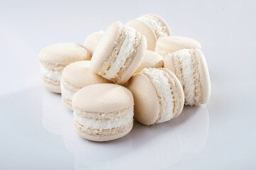 Close up view. Bunch of macarons on the white surface