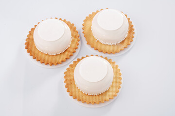 A lot of sugar. Sweet cakes on the white surface