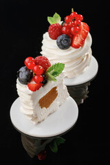 Summer fruit mix. Delicious cake against black background