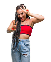 Young braided hair african american with pigmentation blemish birth mark over isolated background smiling looking to the camera showing fingers doing victory sign. Number two.