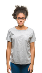Fototapeta premium Young afro american woman wearing glasses over isolated background depressed and worry for distress, crying angry and afraid. Sad expression.