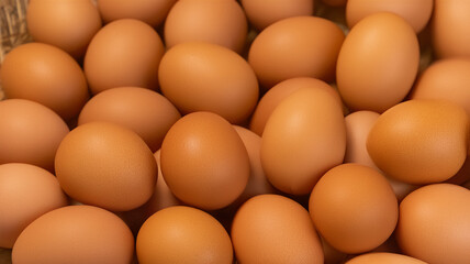 Pile of fresh brown eggs in natural light