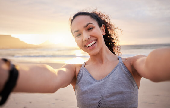 Happy woman, portrait and fitness with selfie for beach sunset, workout or outdoor training. Young, female person or runner with smile for photography, memory or picture after exercise by ocean coast