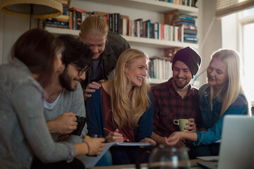 Diverse student friends studying together at home