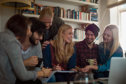 Diverse student friends studying together at home