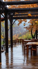 A wooden deck with tables and umbrellas on it